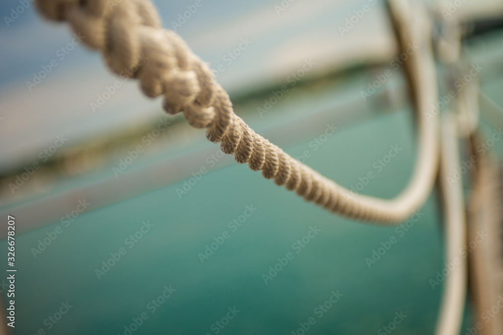 Naklejka premium Close up of hanging rope at marina