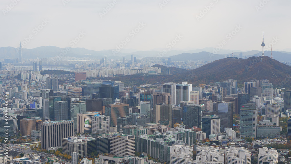 Downtown in Seoul with skyscrapers and the N Tower on the top of Namsan Mountain in South Korea.