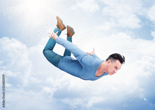 Canvas-taulu Crazy desperate man in casual wear flies in the sky