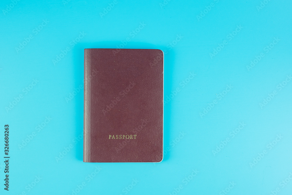Top view passport on blue background with copy space for text
