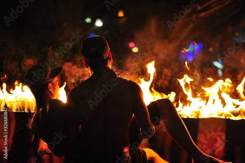 Fire show performance at a beachfront restaurant in Thailand tourist attraction