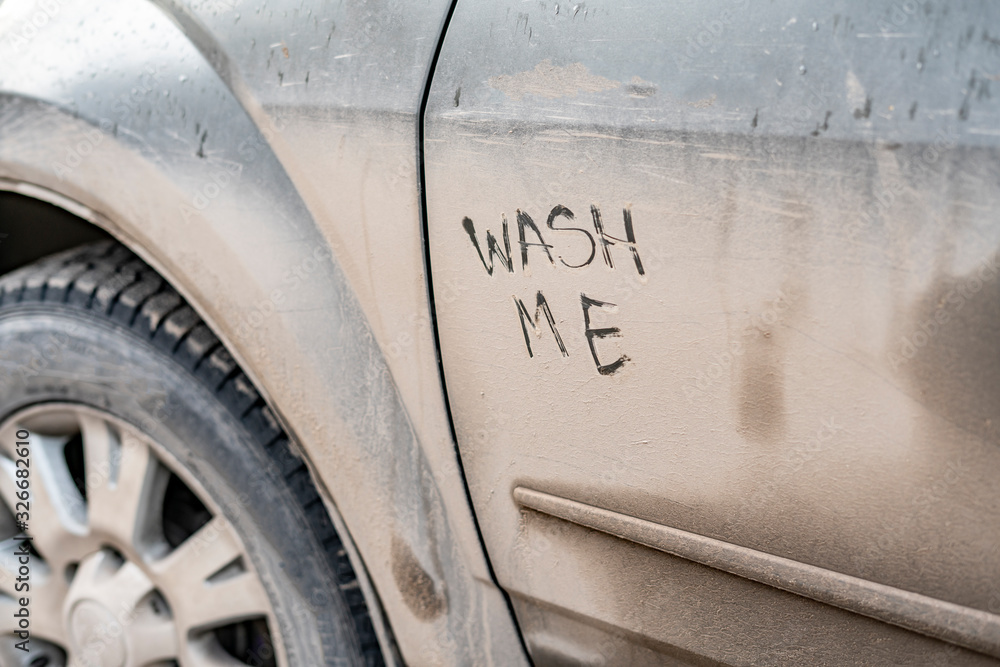 wash me text handwritten on the car vehicle during bad rainy weather season - obrazy, fototapety, plakaty 