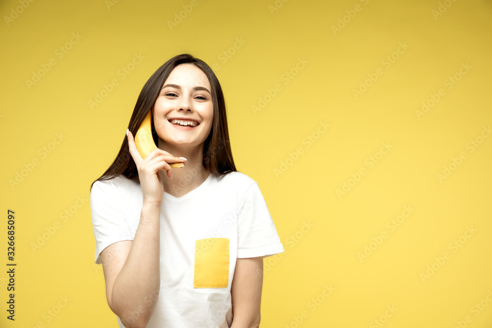 a woman making fun with a banana a woman making fun with a banana
