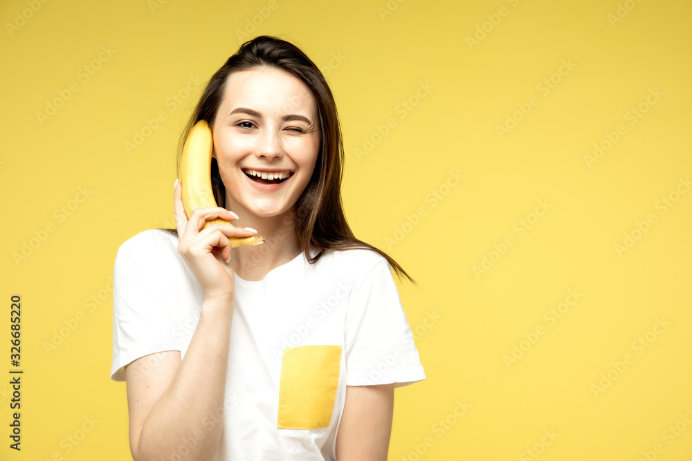 a woman making fun with a banana a woman making fun with a banana