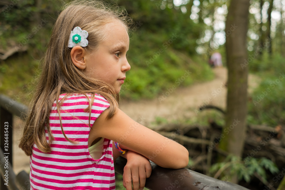 Little girl enjoying the beautiful nature view Little girl enjoying the beautiful nature view