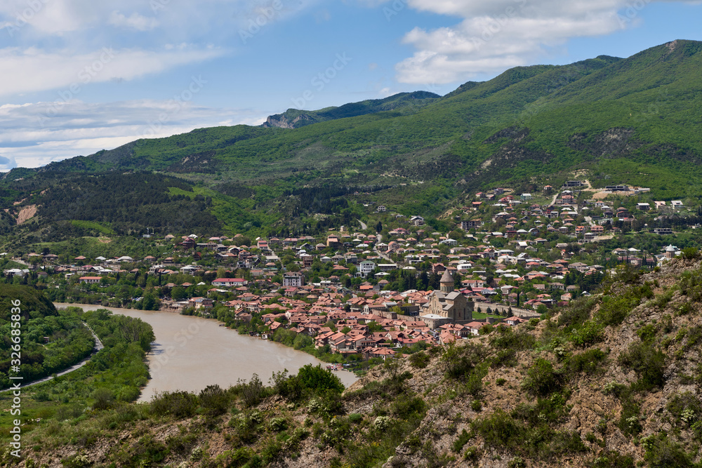 Panoramic view of Mtskheta (Mccheta) former capital city and one of oldest cities in Georgia on the bank of Kura river with Svetitskhoveli Cathedral Temple (Sweti Cchoweli)