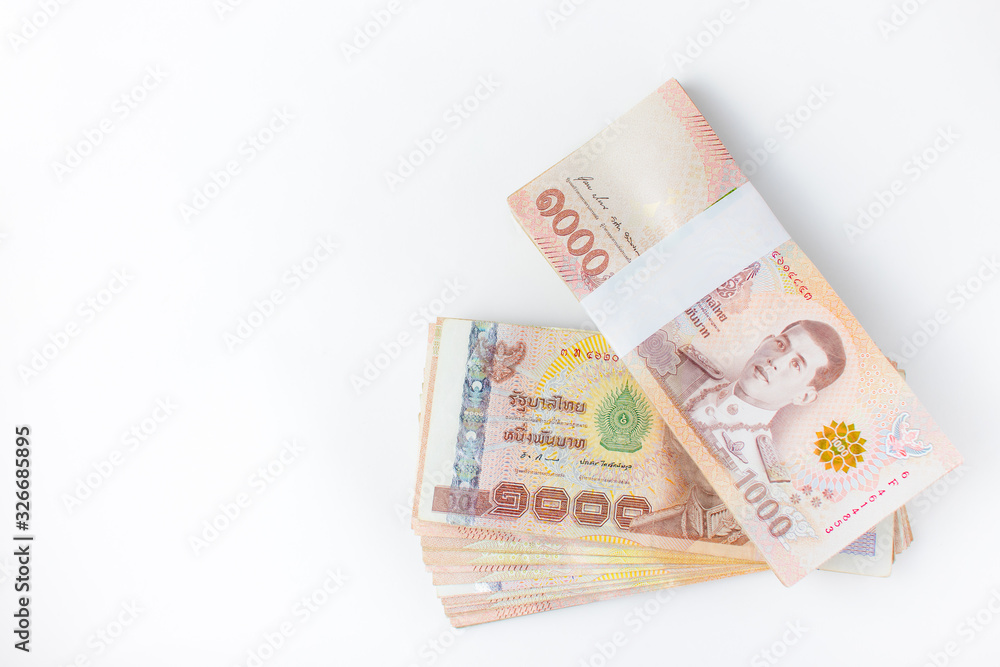Thai money banknotes 1000 baht on white background, business investment concept .Top view. Thai money banknotes 1000 baht on white background, business investment concept .Top view.