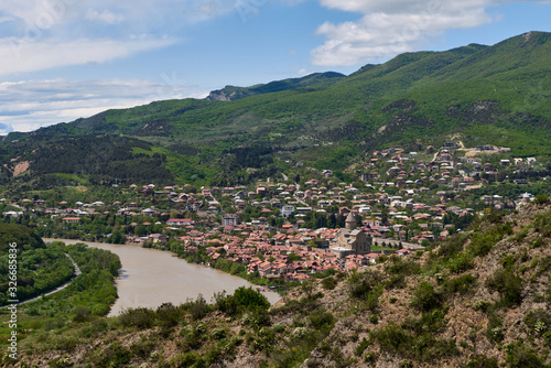 Panoramic view of Mtskheta (Mccheta) former capital city and one of oldest cities in Georgia on the bank of Kura river with Svetitskhoveli Cathedral Temple (Sweti Cchoweli) photo
