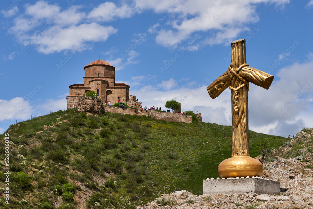 Yellow cross in the background of Jvari Monastery Yellow cross in the background of Jvari Monastery