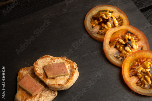 Pork tenderloin dish with pate and tomato and walnut salad photo