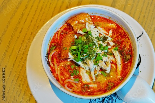 A bowl of hot Malaysian laksa soup