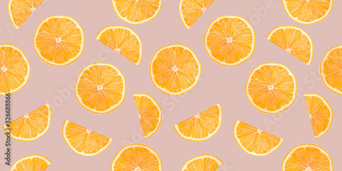 pattern with orange slices on a light pink background