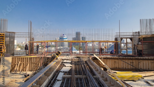 Valokuva Construction workers working on steel rods used to reinforce concrete timelapse