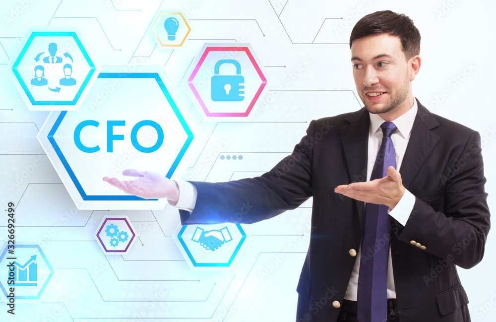 Business, Technology, Internet and network concept. Young businessman working on a virtual screen of the future and sees the inscription: CFO Business, Technology, Internet and network concept. Young businessman working on a virtual screen of the future and sees the inscription: CFO