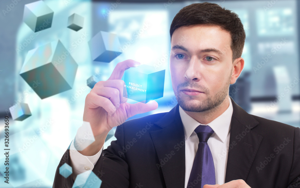 Business, Technology, Internet and network concept. Young businessman working on a virtual screen of the future and sees the inscription: Project management Business, Technology, Internet and network concept. Young businessman working on a virtual screen of the future and sees the inscription: Project management