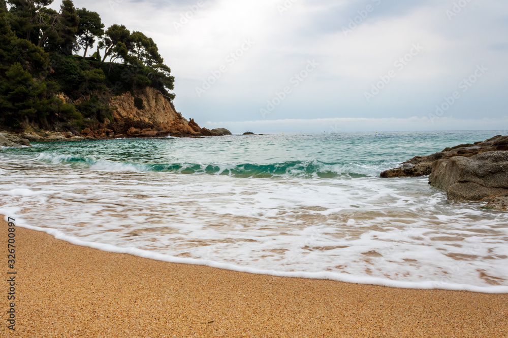 Nice and quiet beach with small waves, called Sa Boadella in Lloret de Mar