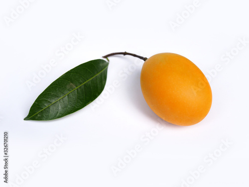 Quadro em tela Sweet yellow marian plum fruit, maprang or mayongchid with green leaves isolated on white background