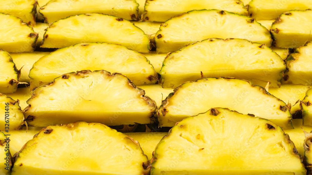 Pineapple juicy yellow slices background. Top view. Pineapple juicy yellow slices background. Top view.