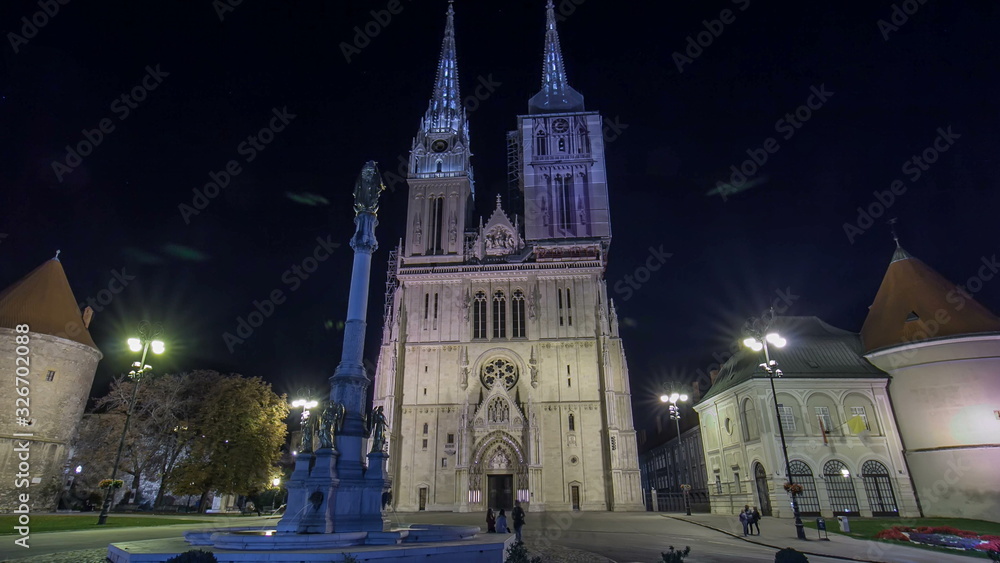 Entrance to Zagreb Cathedral night timelapse  and Monument called Maria's pillar. ZAGREB, CROATIA