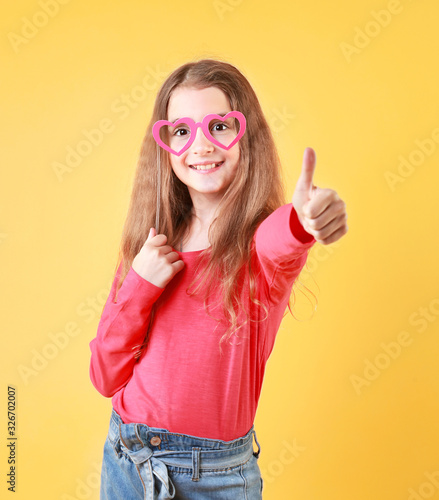 Child young girl thumb finger up positive emotions concept.