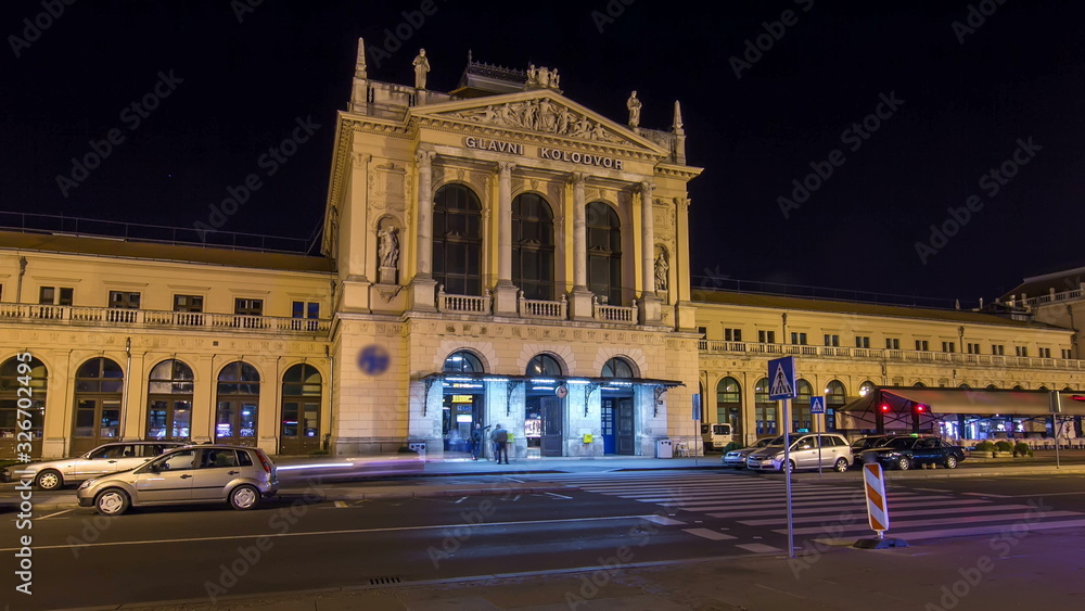 People on the Tomislav Square in front of Main Railway Station night timelapse , main hub of Croatian Railways network. ZAGREB, CROATIA