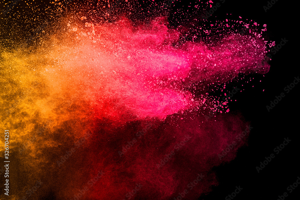 Freeze motion of red yellow color dust particles splashing.