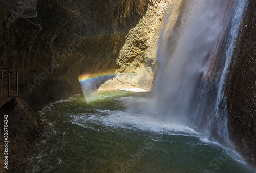 Rainbow at the HaTanur waterfall flows from a crevice in the mountain and is located in the continuation of the rapid, shallow, cold mountain Ayun river in the Galilee in northern Israel