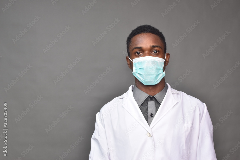 young black man wearing a white coat and face mask young black man wearing a white coat and face mask