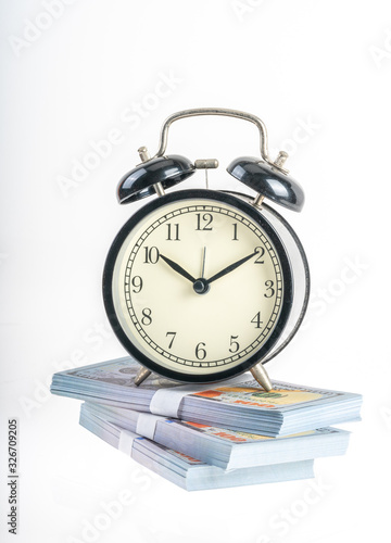 Clock and banknote with white background.