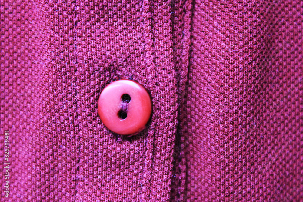 Simple button on vivid purple cloth texture background. Casual clothes button close up, bright violet cotton cloth material, plain blank clothes fabric top view Simple button on vivid purple cloth texture background. Casual clothes button close up, bright violet cotton cloth material, plain blank clothes fabric top view