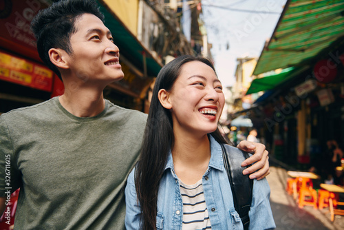 Happy couple exploring the Hanoi city
