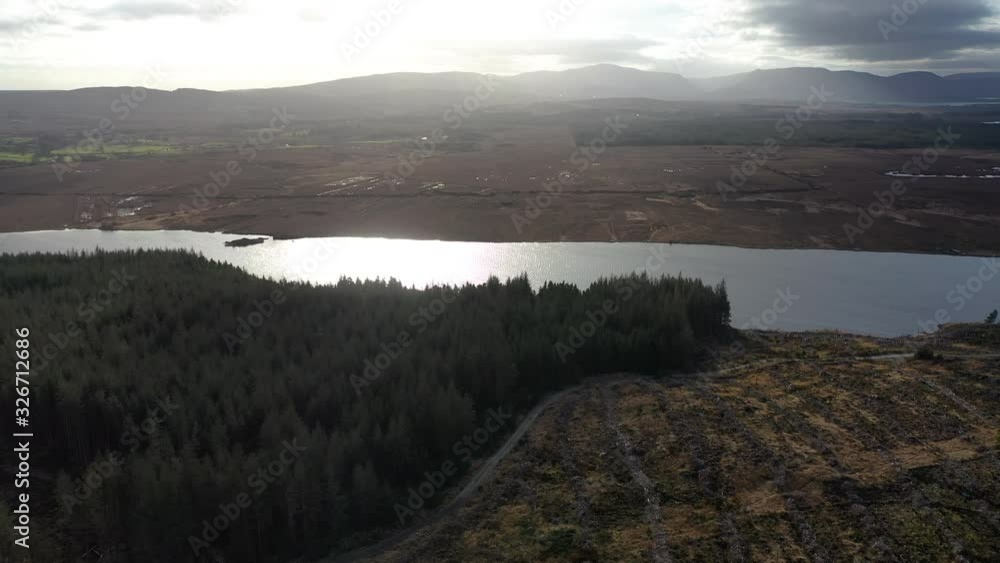Flying over peatbog next to the town Glenties in County Donegal - Ireland Flying over peatbog next to the town Glenties in County Donegal - Ireland