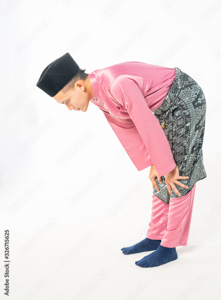 Teenager wearing traditional costume with posture of pray step.