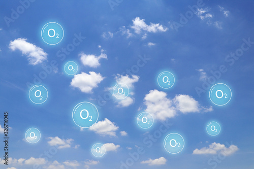 Cloud and blue sky with oxygen symbols floating around. Oxygen floating in the air.