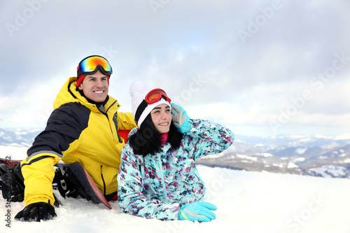 Lovely couple on snowy hill. Winter vacation © New Africa