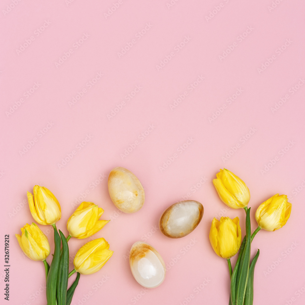 Easter composition with natural flower of tulips and decorative eggs from gemstone onyx. Spring Easter holiday pattern for greeting card with copy space. Flat lay. Easter composition with natural flower of tulips and decorative eggs from gemstone onyx. Spring Easter holiday pattern for greeting card with copy space. Flat lay.