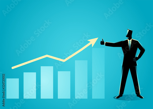 Businessman posing doing thumb up with increasing graphic chart