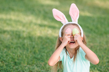 Portrait of kid with easter busket with eggs outdoor