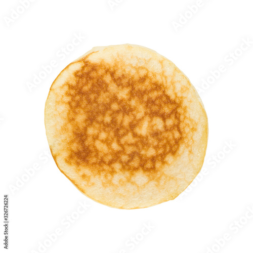Pancake top isolated on white background. Baked round hotcake top view closeup
