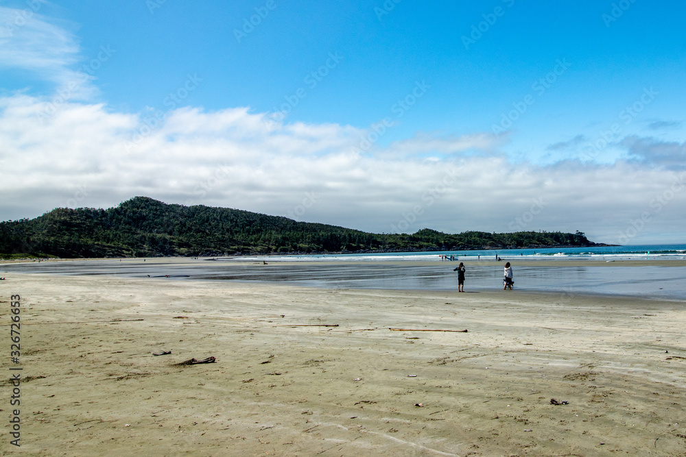 Surfers getting ready at Tofino, Vancouver Island, BC, Canada