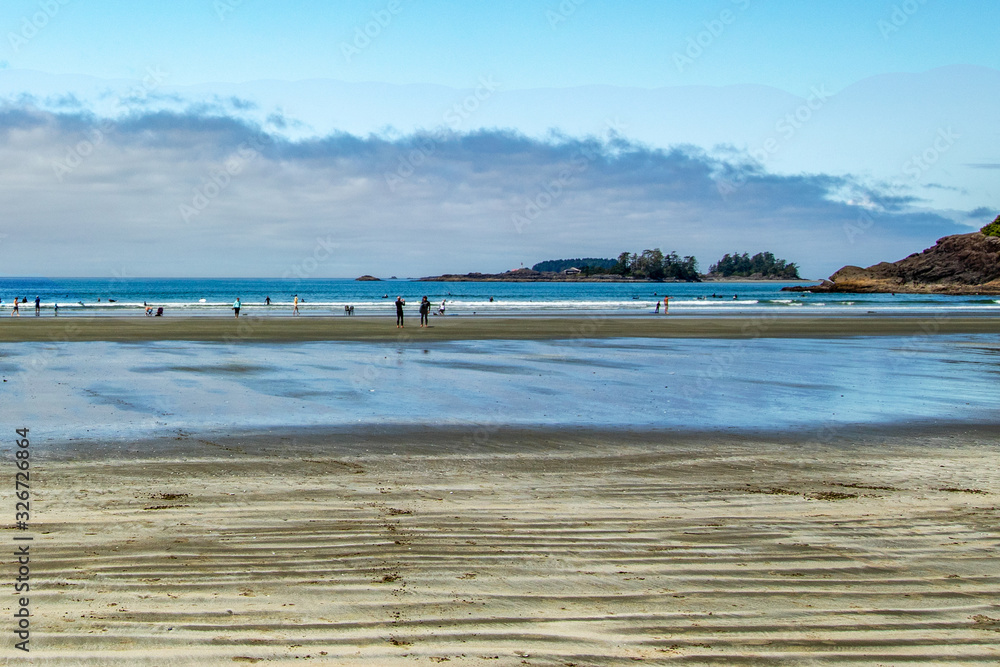Surfers returning from practice - Tofino, Vancouver Island, BC, Canada Surfers returning from practice - Tofino, Vancouver Island, BC, Canada