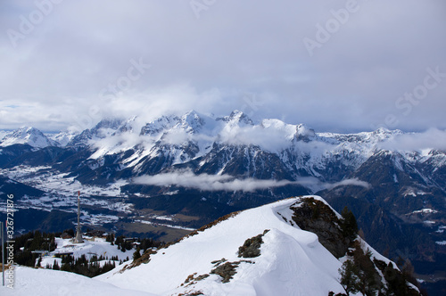 alps in winter at a  cold day with low clouds and nice view © Harald