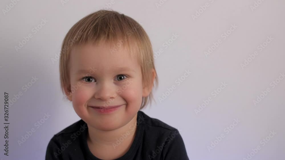 Close up portrait of cute little boy laughing having positive emotion face of happy child Close up portrait of cute little boy laughing having positive emotion face of happy child
