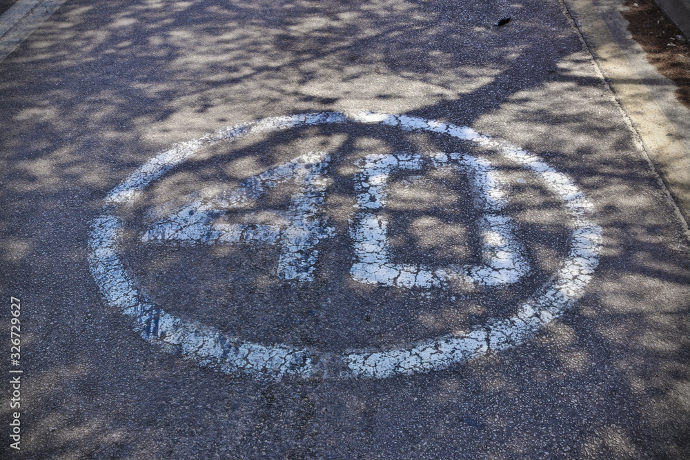 Number forty in a circle painted in white on a the street