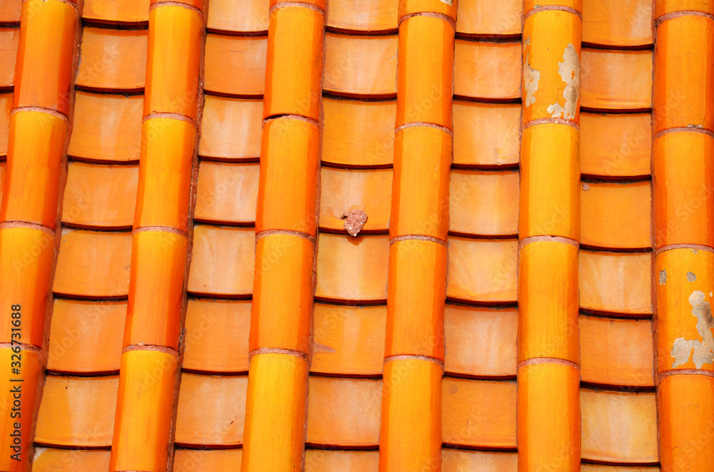 Arrangement of yellow tiles on the roof Arrangement of yellow tiles on the roof