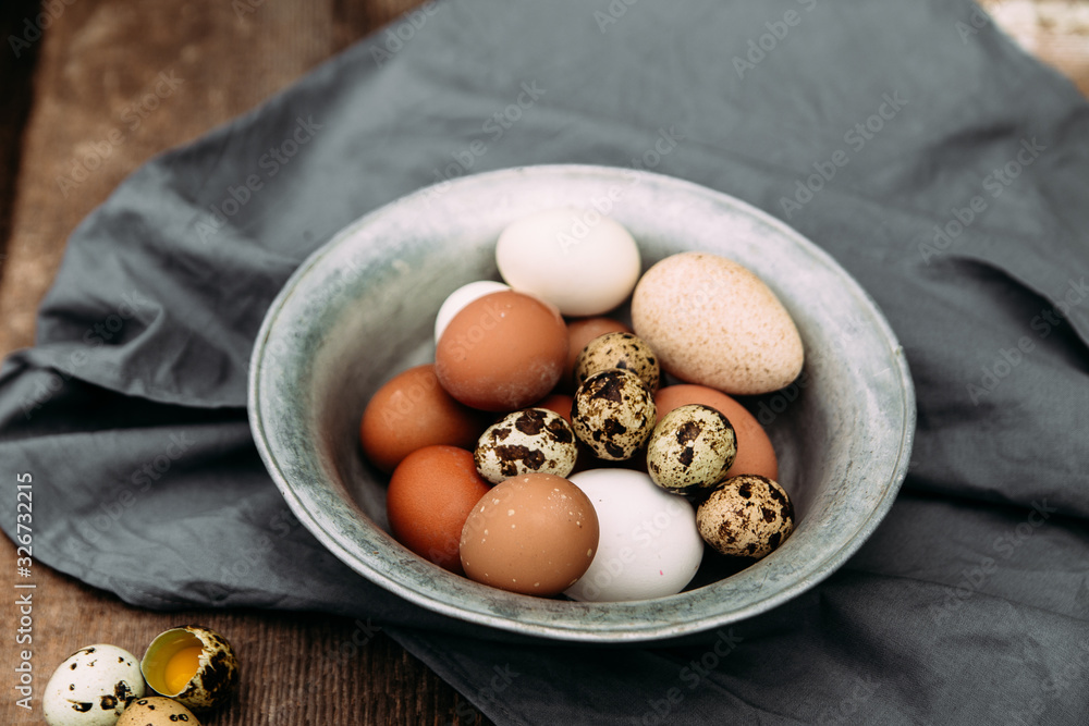 Chicken and quail eggs close-up Chicken and quail eggs close-up