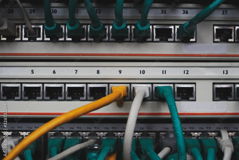 Inside of a server room. Three cables of different color in connectors. Equipment service in datacenter. A bunch of wires. Inside of a server room. Three cables of different color in connectors. Equipment service in datacenter. A bunch of wires.