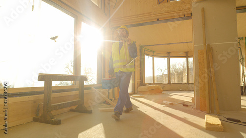 LENS FLARE: Content builder walks out of a CLT house after a long day at work