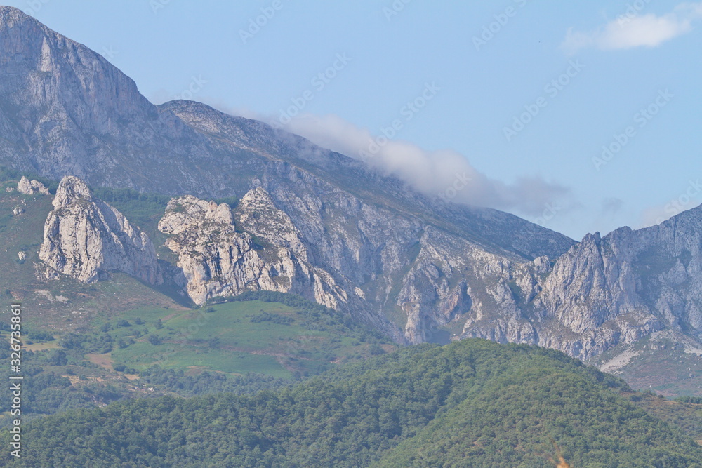 Fototapeta premium Potes, Cantabria/Spain; Aug. 03, 2015. The first peaks of Picos de Europa in Potes.