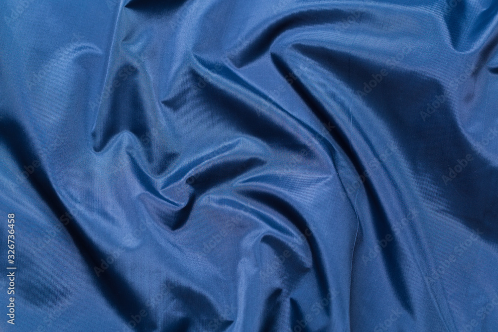 Fototapeta premium Blue fabric cloth texture. abstract texture background with soft waves.